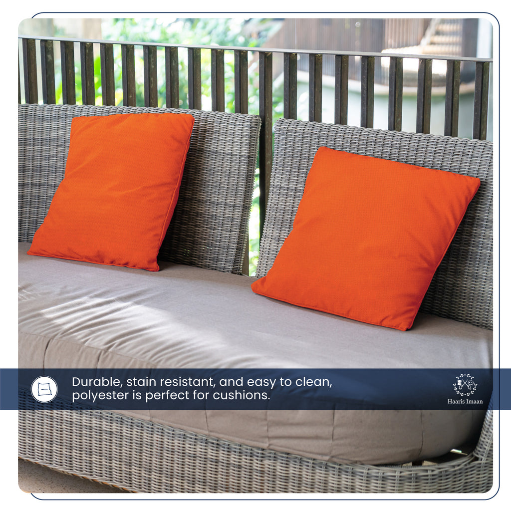 Garden furniture adorned with orange fabric, highlighting its functional and stylish use.