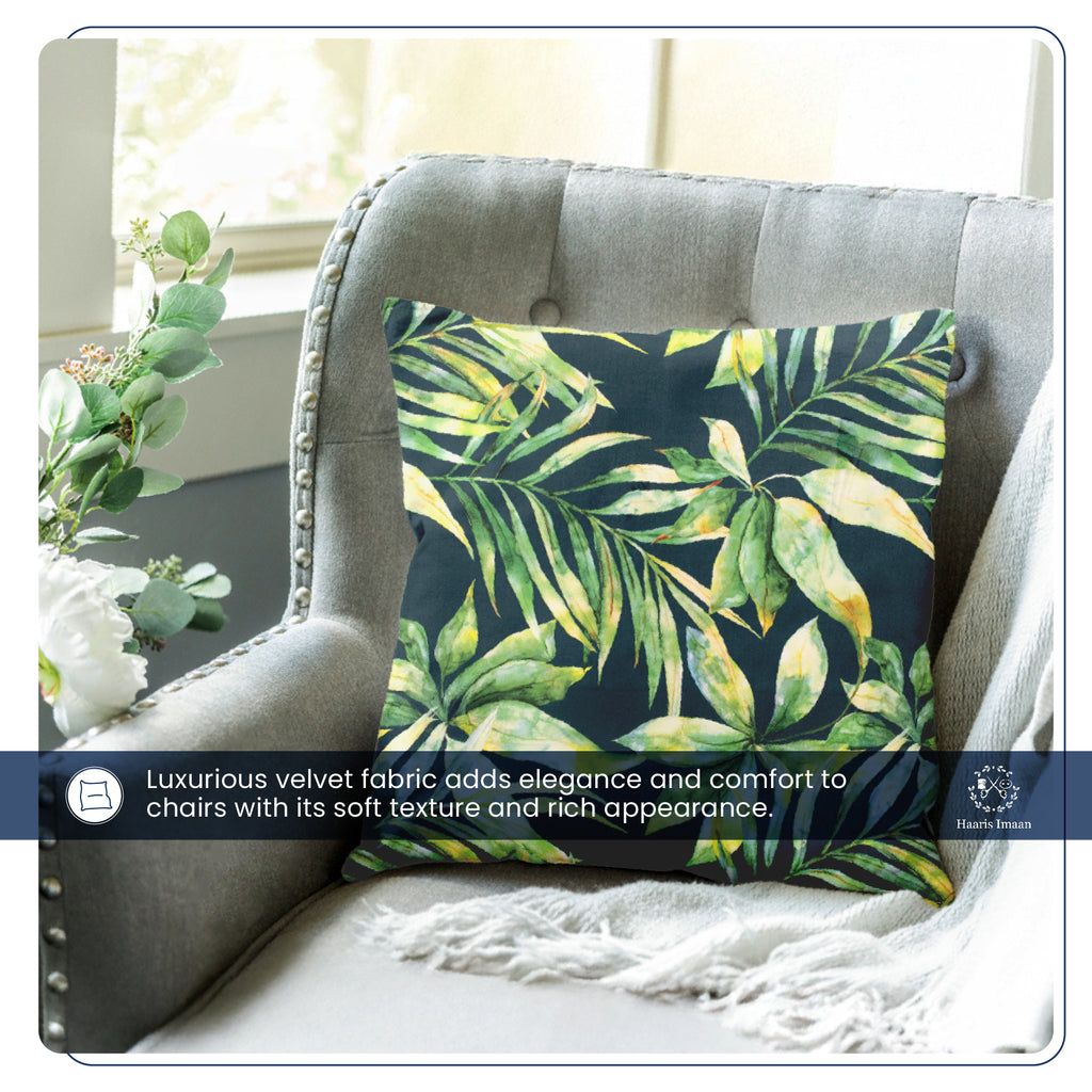 Cushion covered in tropical leaves printed velvet fabric, showing its plush texture and bold pattern.