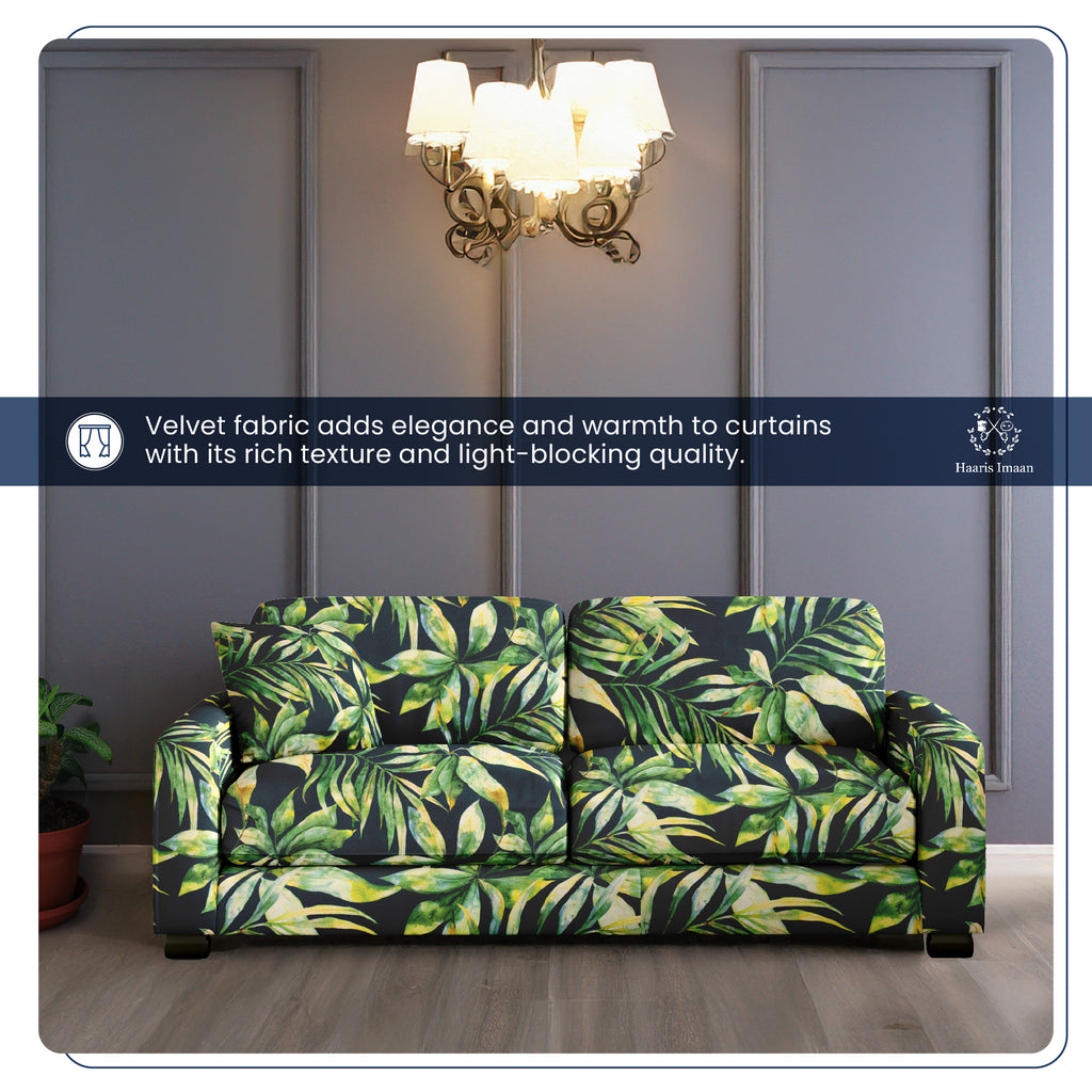 Roll of printed velvet fabric with a tropical leaves design, ideal for upholstery projects.