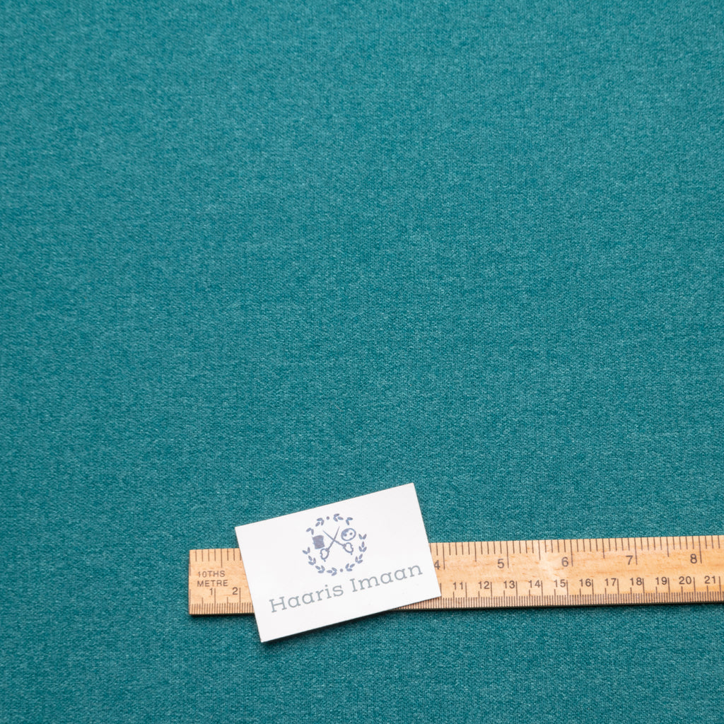 Roll of Teal Wool Effect Upholstery Fabric, perfect for a variety of upholstery projects.